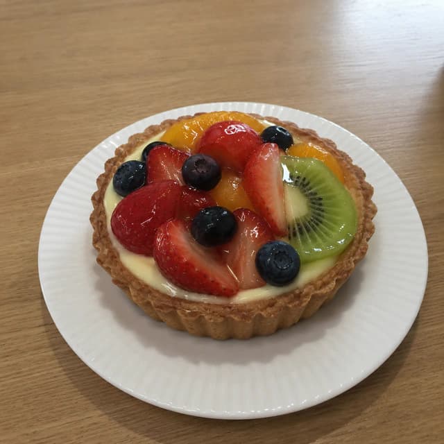 Original restaurant photo of a fresh fruit tart