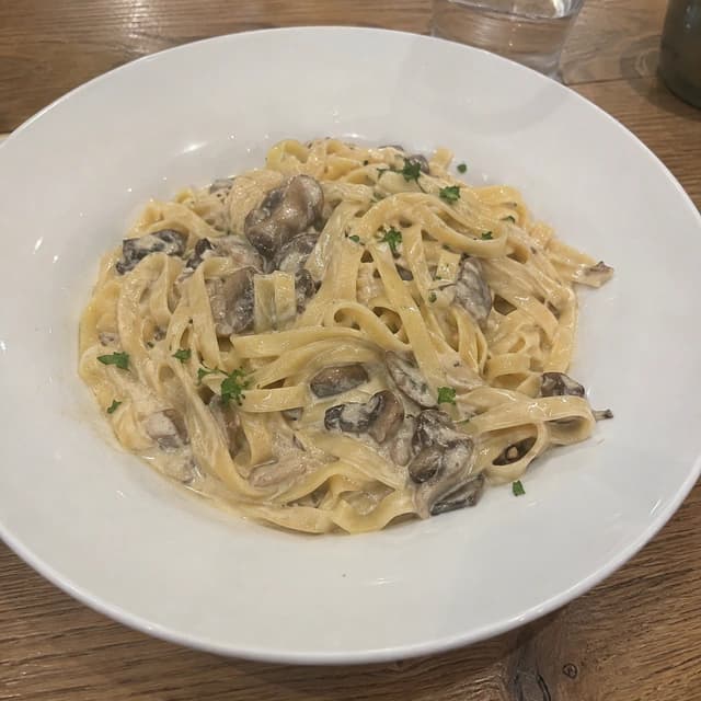 Original restaurant photo of creamy mushroom pasta