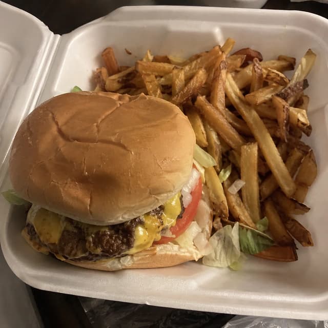 Original takeout photo of a cheeseburger and fries