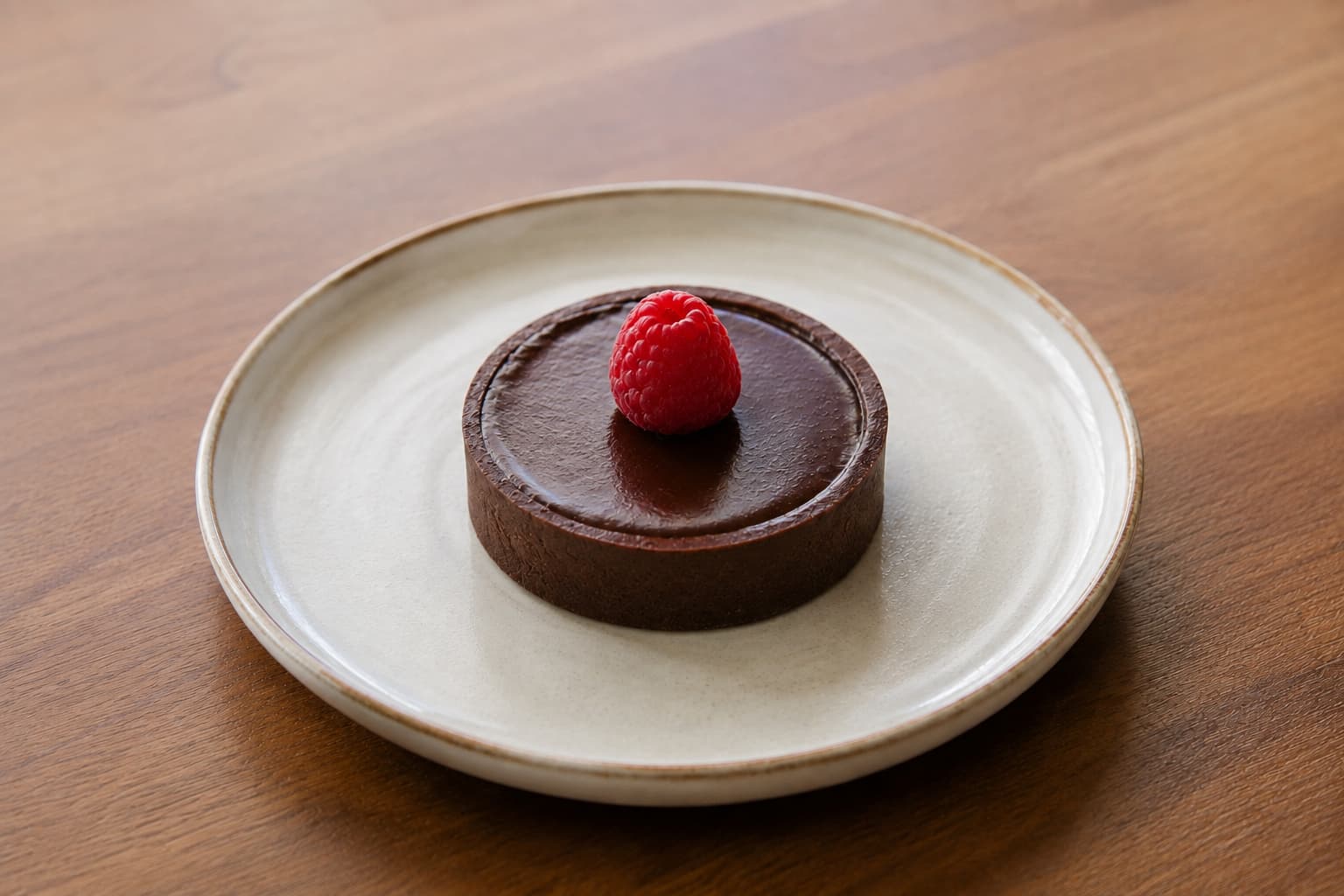 The same chocolate tart after the table and plate were cleaned
